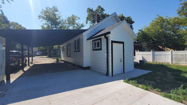 exterior space featuring a carport and driveway