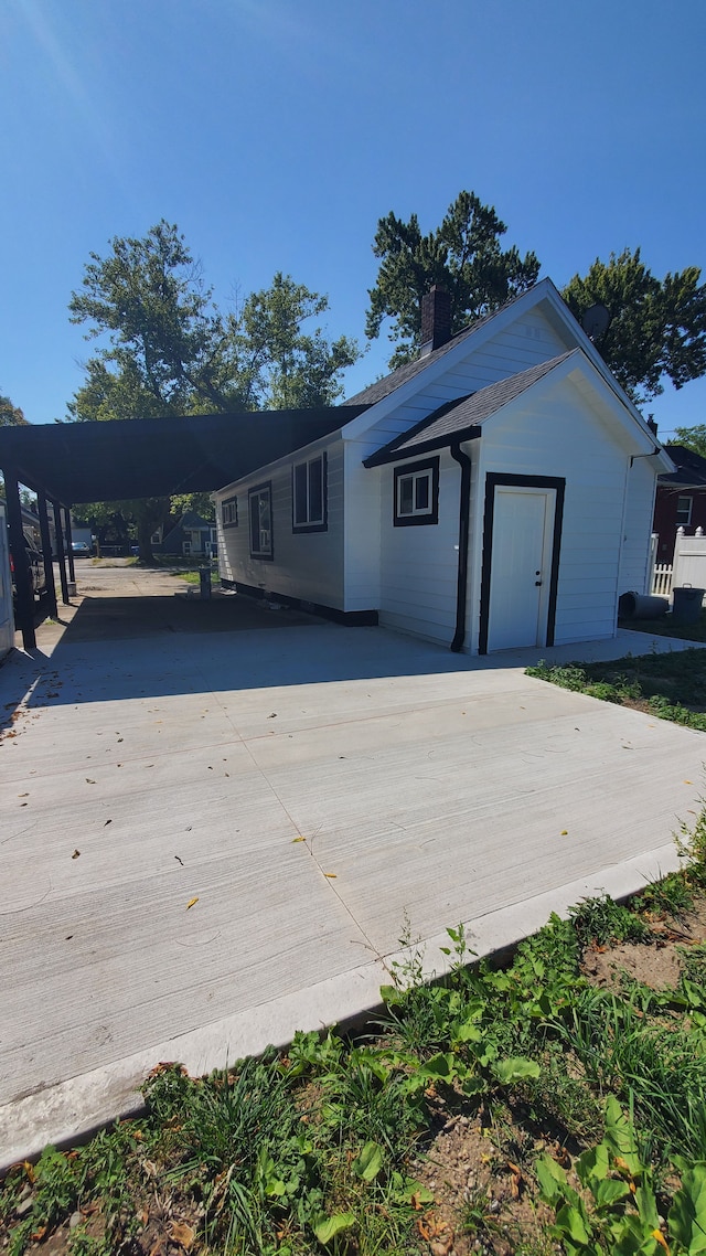 exterior space featuring a carport