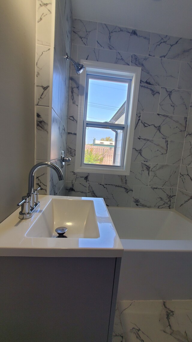 bathroom with vanity, a bath, a shower, and marble finish flooring