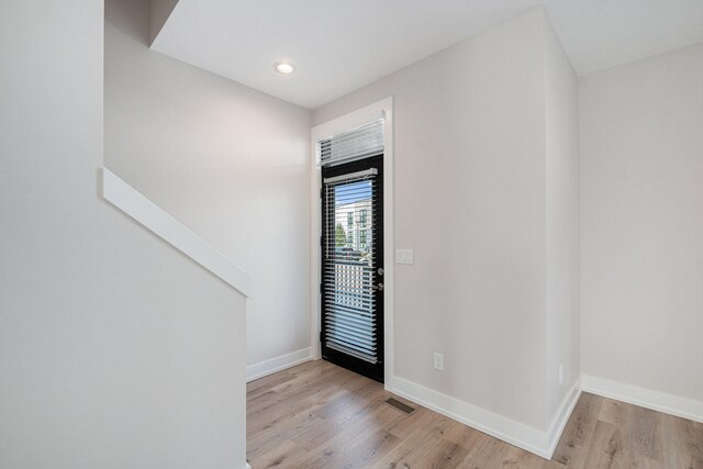 entryway with light hardwood / wood-style flooring