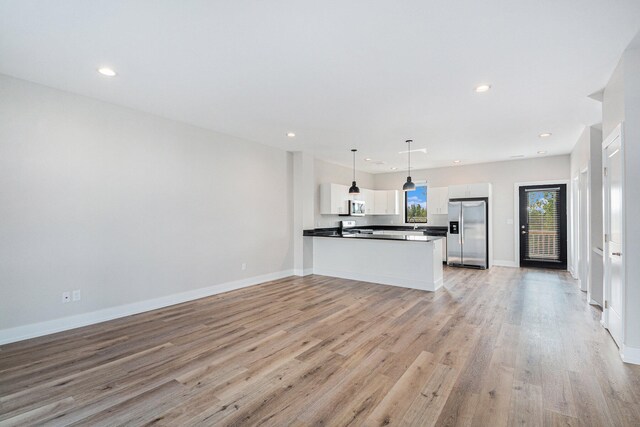 unfurnished living room featuring light hardwood / wood-style flooring