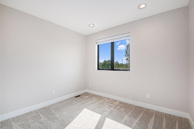 empty room featuring carpet flooring