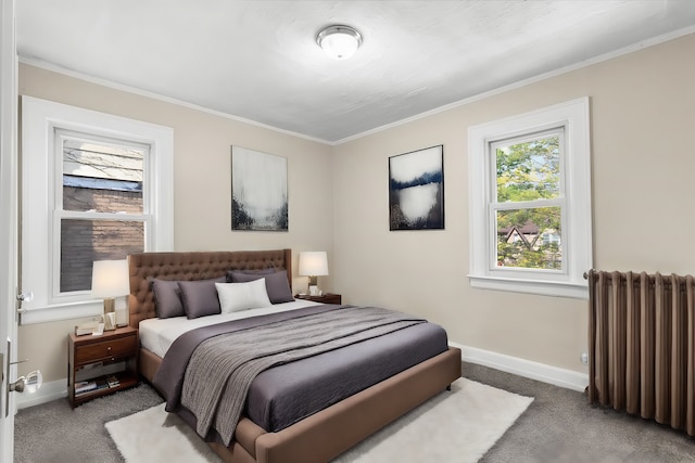 carpeted bedroom with ornamental molding and radiator