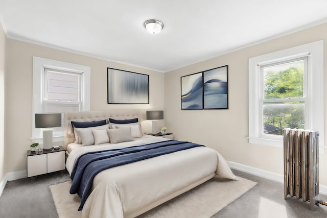 carpeted bedroom featuring radiator heating unit and ornamental molding