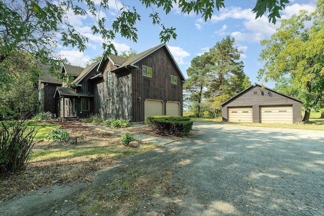 5430 Tittabawassee Rd, Kochville, MI 48604 - view of side of property featuring a garage