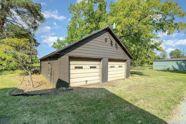 garage featuring a yard