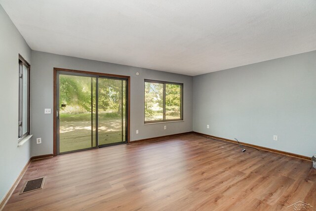 5430 Tittabawassee Rd, Kochville, MI 48604 - empty room featuring light wood-style flooring and baseboards