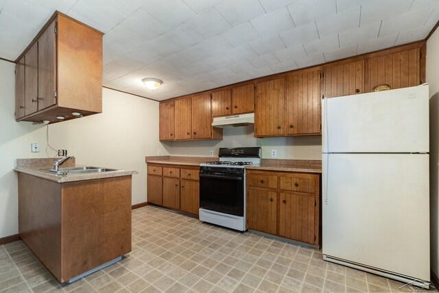 5430 Tittabawassee Rd, Kochville, MI 48604 - kitchen featuring freestanding refrigerator, gas range, under cabinet range hood, a sink, and brown cabinetry