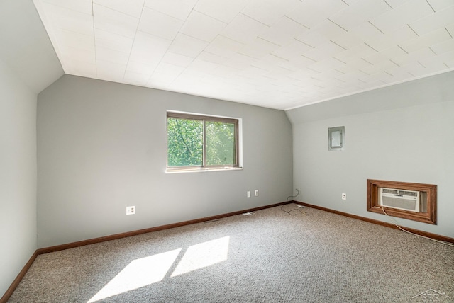 bonus room featuring carpet floors, a wall unit AC, and lofted ceiling