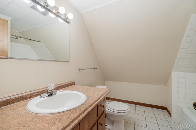 full bathroom with vanity, tile patterned flooring, tiled shower / bath combo, toilet, and ornamental molding