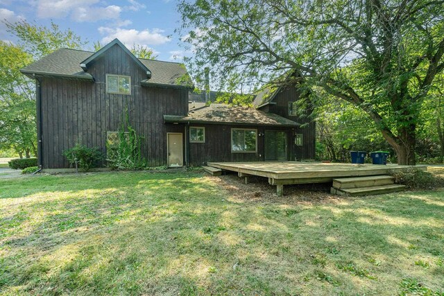 5430 Tittabawassee Rd, Kochville, MI 48604 - back of house featuring a wooden deck and a lawn