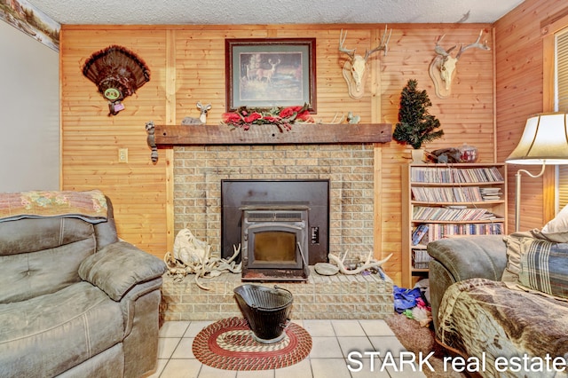 tiled living room with wooden walls and a textured ceiling