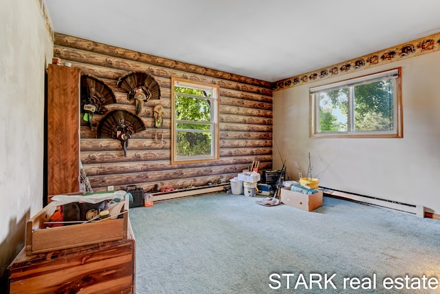 miscellaneous room featuring baseboard heating, rustic walls, and carpet floors