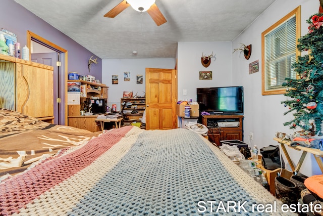 bedroom featuring a textured ceiling and ceiling fan