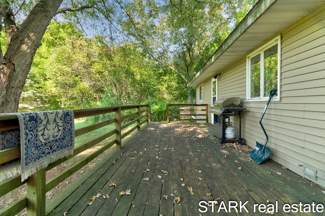 deck featuring a grill