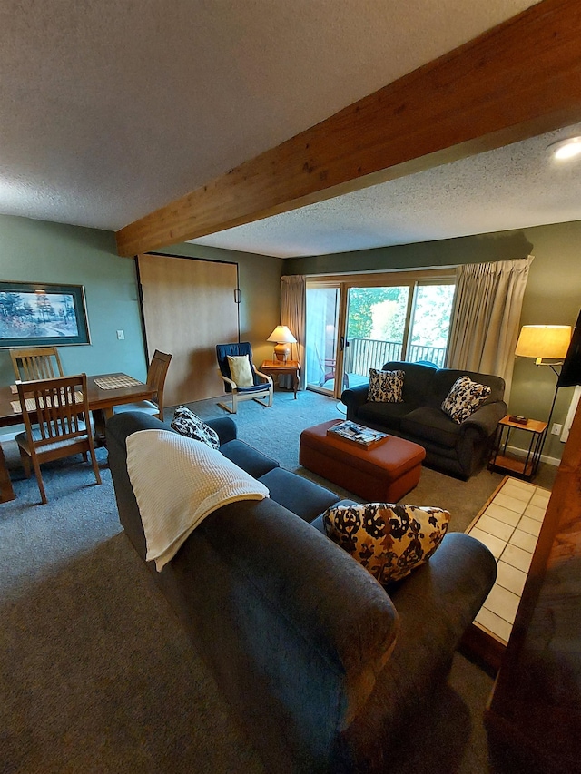 carpeted living room with beamed ceiling and a textured ceiling