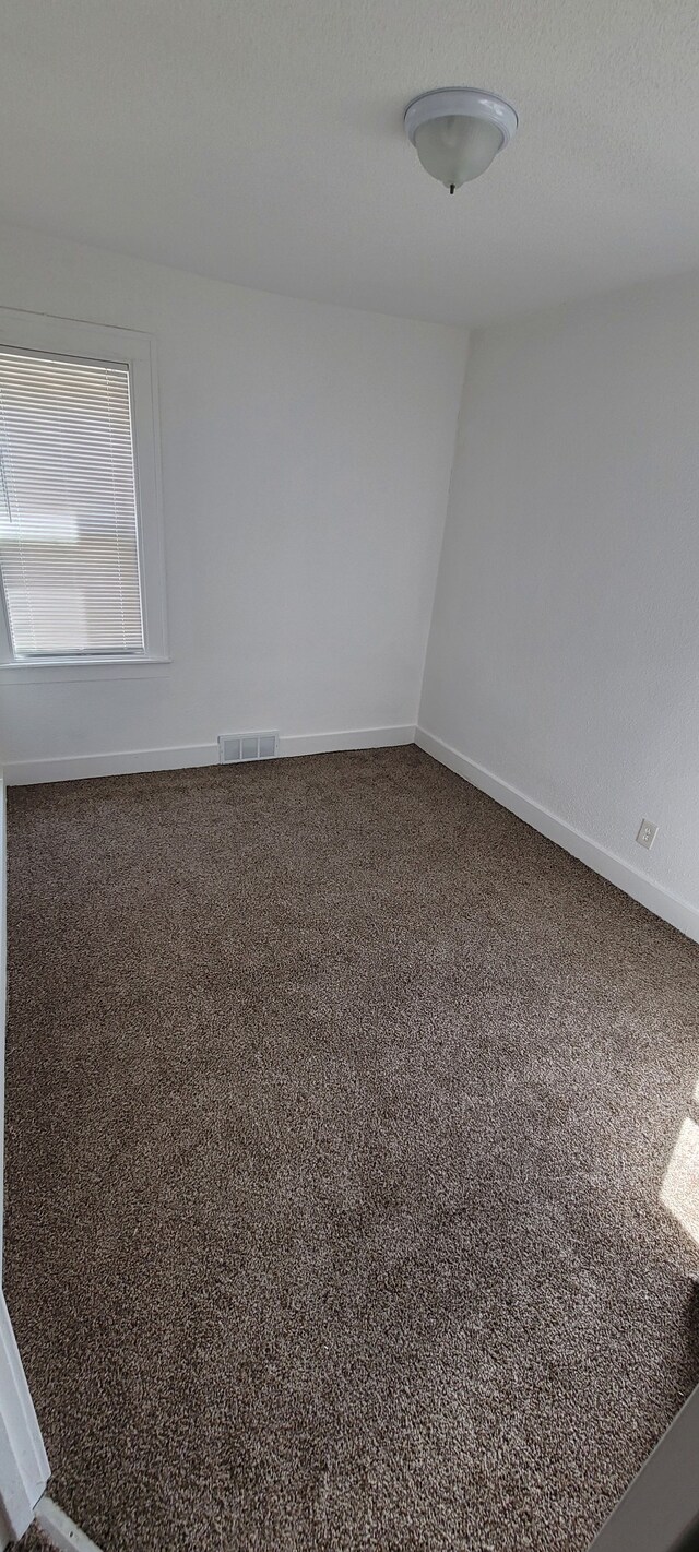 9185 Meyers Rd, Detroit, MI 48228 - carpeted spare room with baseboards