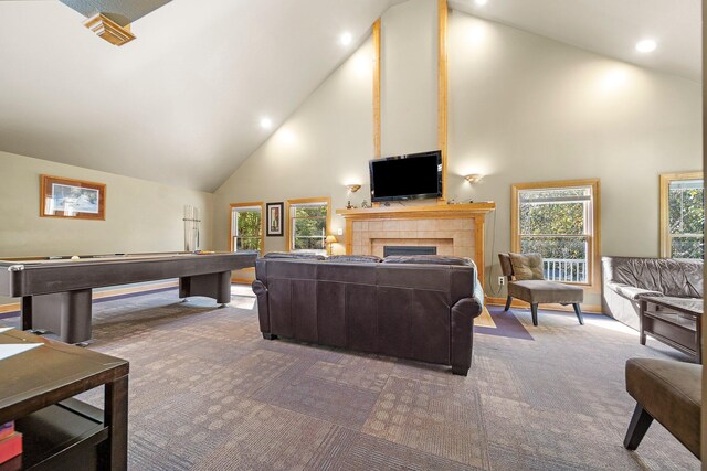 1100 Tisdale Rd, Roscommon, MI 48653 - carpeted living room with high vaulted ceiling, a tiled fireplace, baseboards, recessed lighting, and billiards
