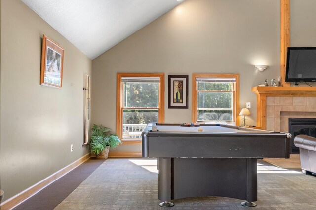 1100 Tisdale Rd, Roscommon, MI 48653 - playroom with carpet, billiards table, a tile fireplace, high vaulted ceiling, and baseboards