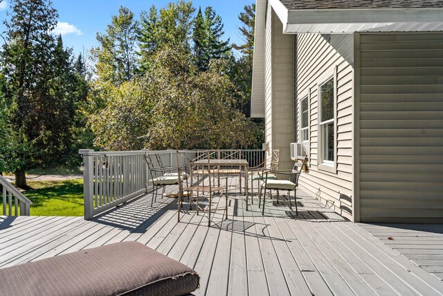 1100 Tisdale Rd, Roscommon, MI 48653 - wooden terrace featuring outdoor dining area