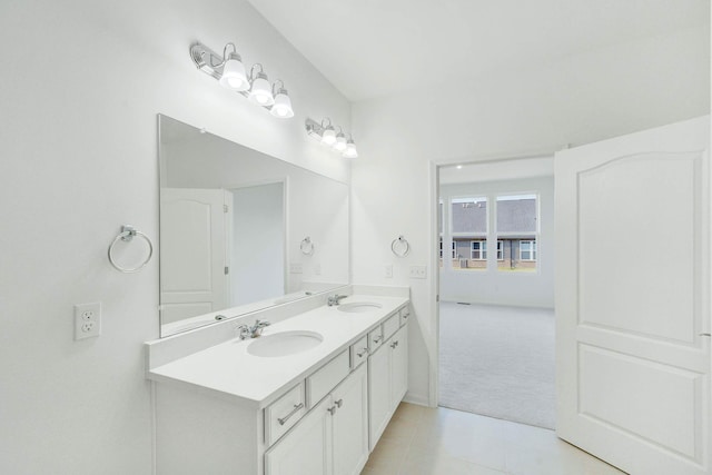 bathroom with tile patterned flooring and vanity