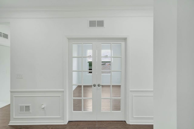 room details featuring wood-type flooring, ornamental molding, and french doors