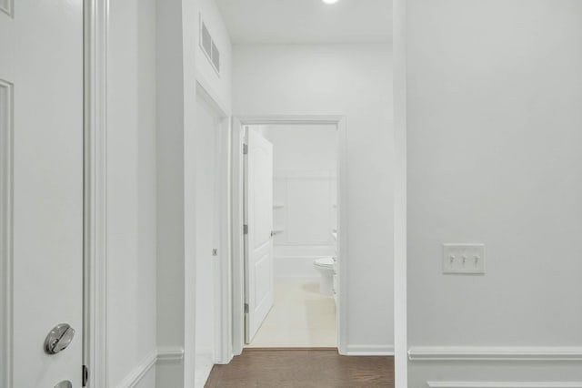 hall with dark hardwood / wood-style floors