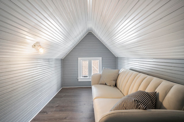 interior space with dark hardwood / wood-style flooring, wooden walls, lofted ceiling, and wood ceiling