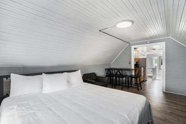 bedroom with stainless steel fridge, dark hardwood / wood-style flooring, wooden ceiling, and lofted ceiling