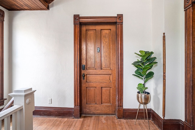 foyer entrance with hardwood / wood-style floors