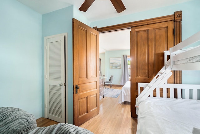 bedroom featuring ceiling fan, a closet, and light hardwood / wood-style floors