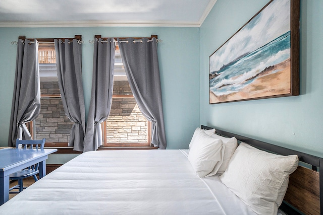 bedroom with multiple windows and ornamental molding