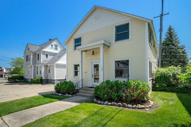 front facade with a front yard