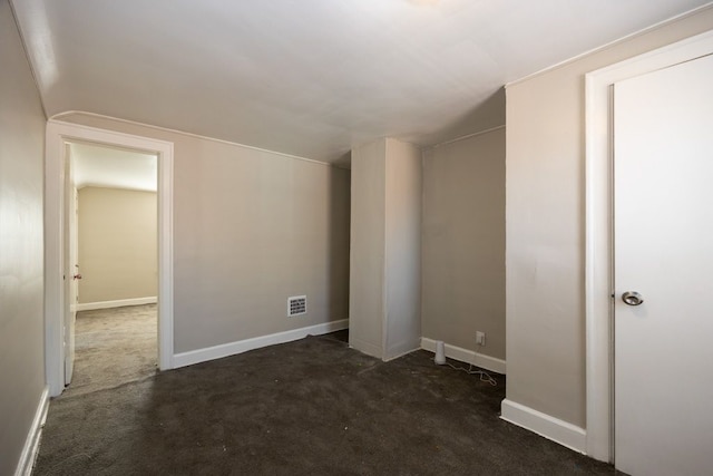 interior space with dark colored carpet