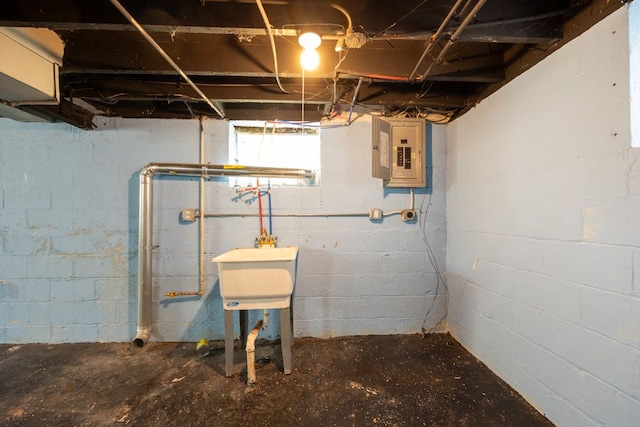 basement with sink and electric panel