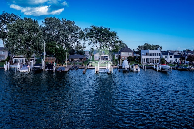 exterior space with a residential view and a water view