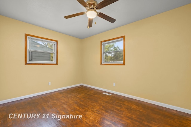 empty room featuring hardwood / wood-style floors and ceiling fan