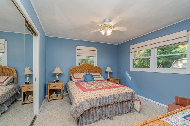 carpeted bedroom featuring ceiling fan