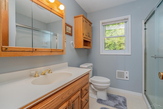 bathroom with vanity, toilet, and walk in shower