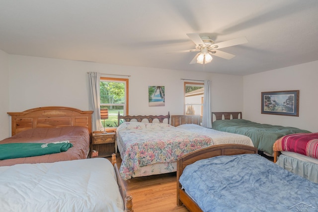 bedroom featuring ceiling fan and light hardwood / wood-style floors