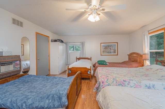 bedroom with light hardwood / wood-style flooring and ceiling fan