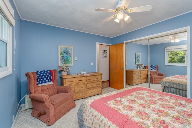 bedroom featuring ceiling fan and a closet