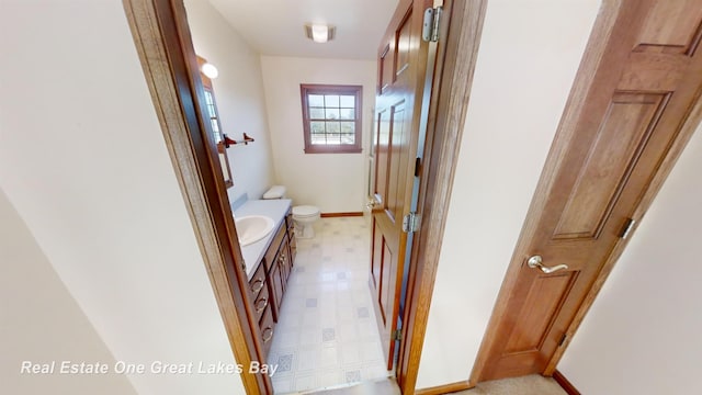 bathroom with vanity and toilet