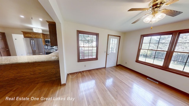 interior space featuring ceiling fan and light hardwood / wood-style floors