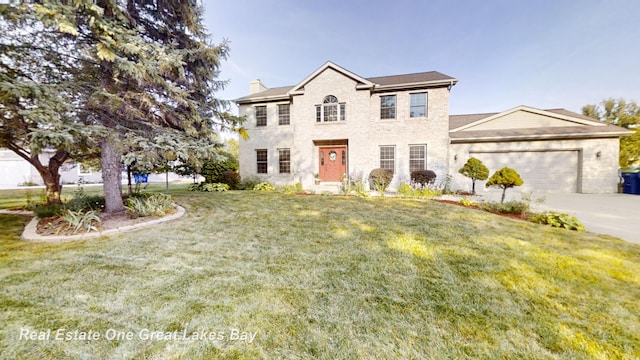 view of front facade featuring a garage and a front yard