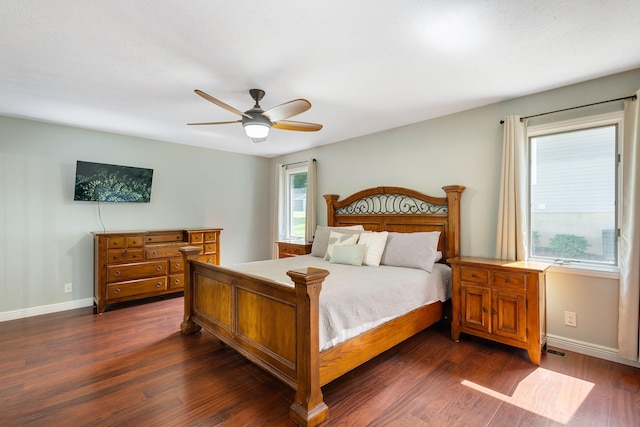 bedroom with ceiling fan and dark wood-type flooring