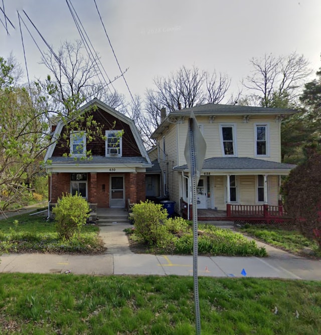 view of front of house with a front lawn and a porch