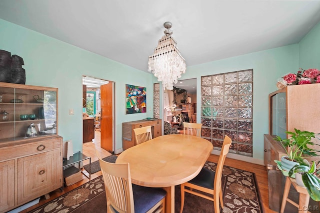 dining space featuring a chandelier and light hardwood / wood-style floors