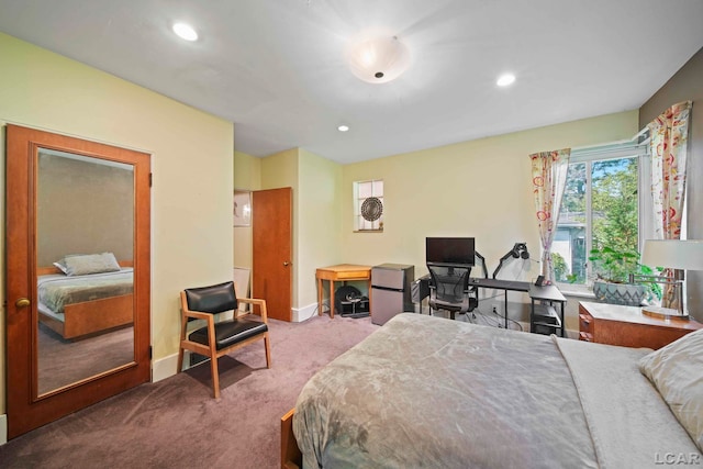 bedroom featuring stainless steel fridge and light carpet