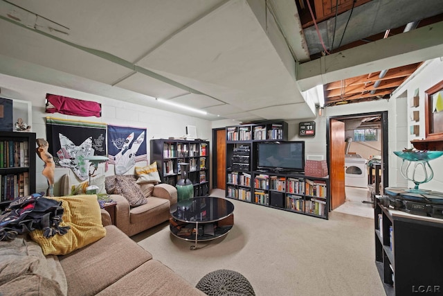 carpeted living room with washer / clothes dryer